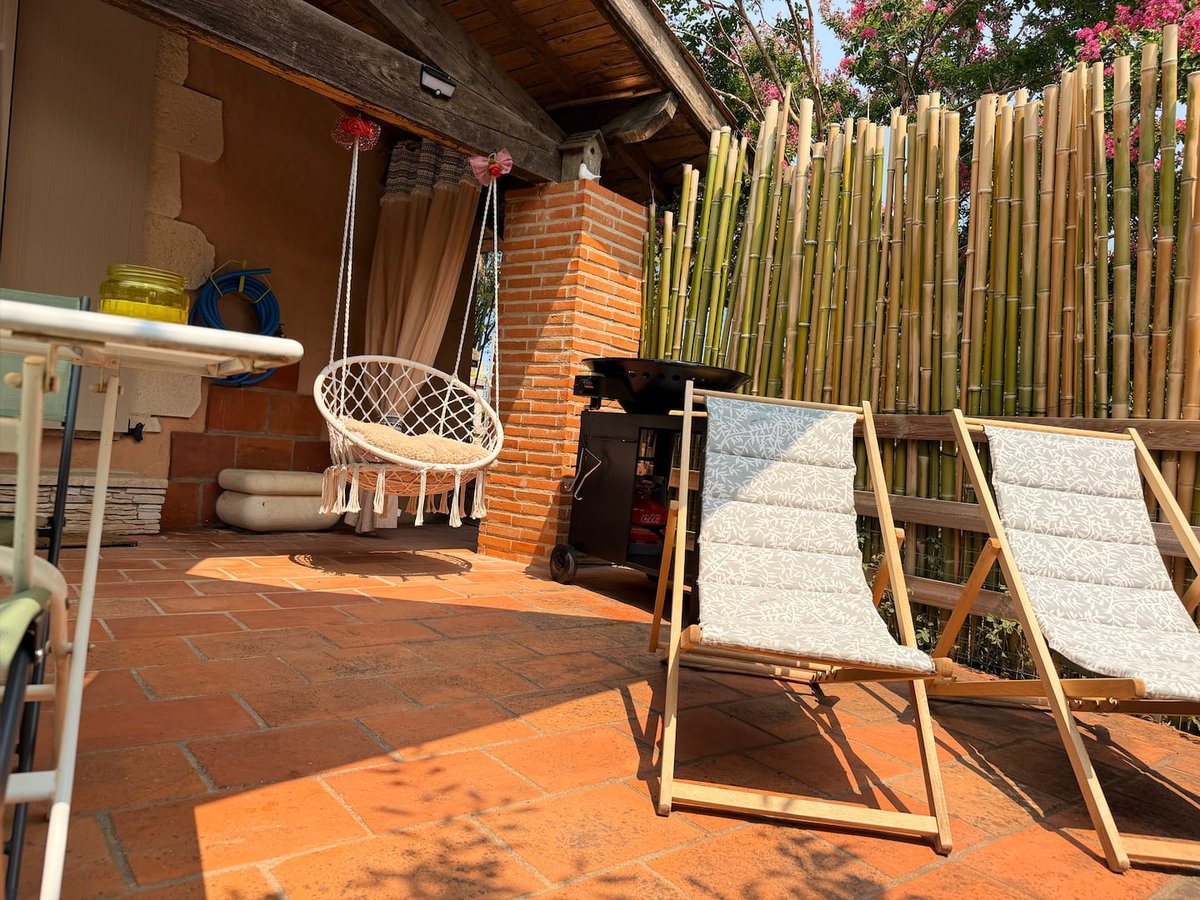 Lou Pitchoun's terrace with hanging chair and sun loungers