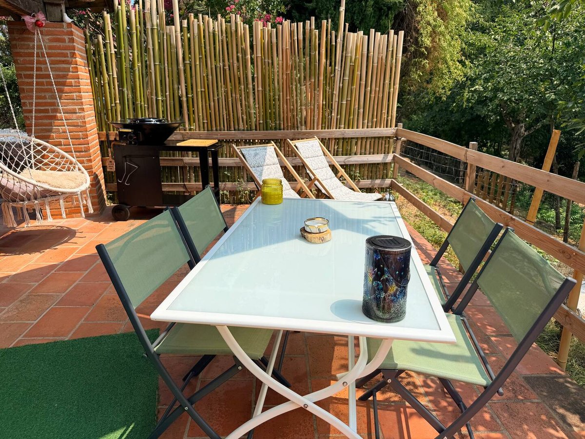 Table on Lou Pitchoun's private terrace, sheltered by the bamboo screen